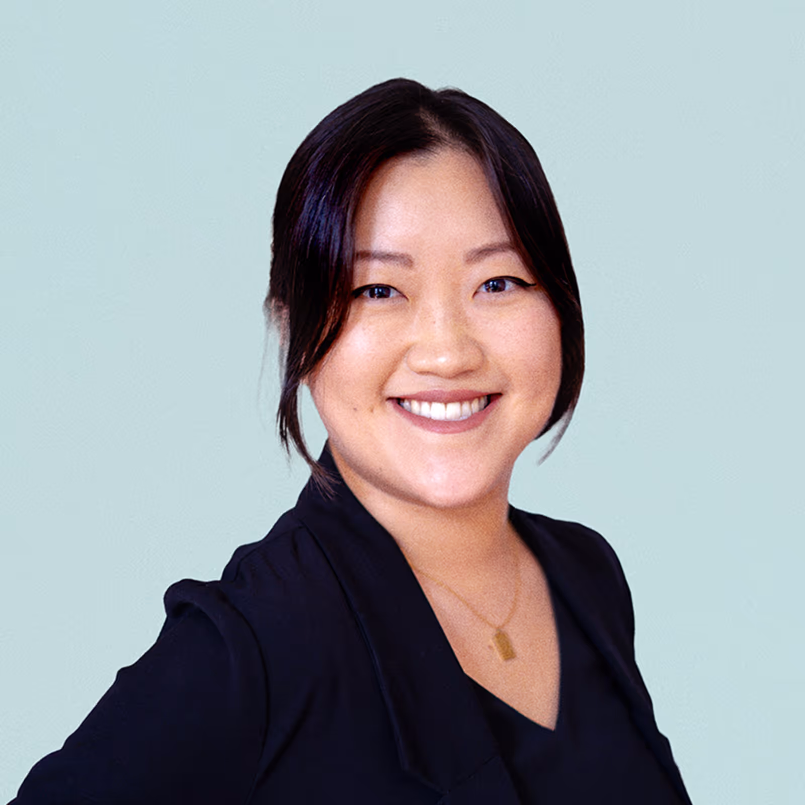 Portrait of Euna Park against a light background.