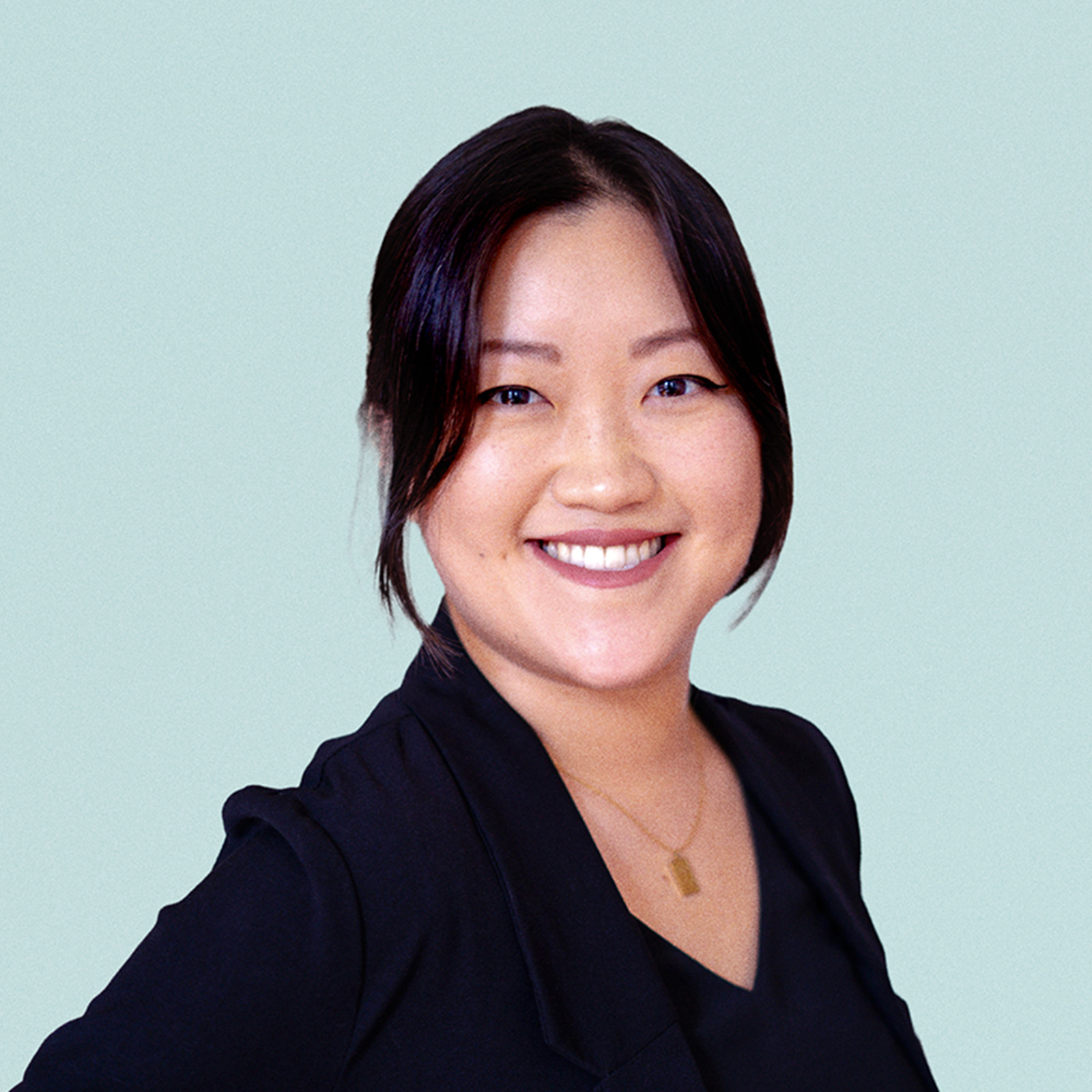 Portrait of Euna Park against a light background.