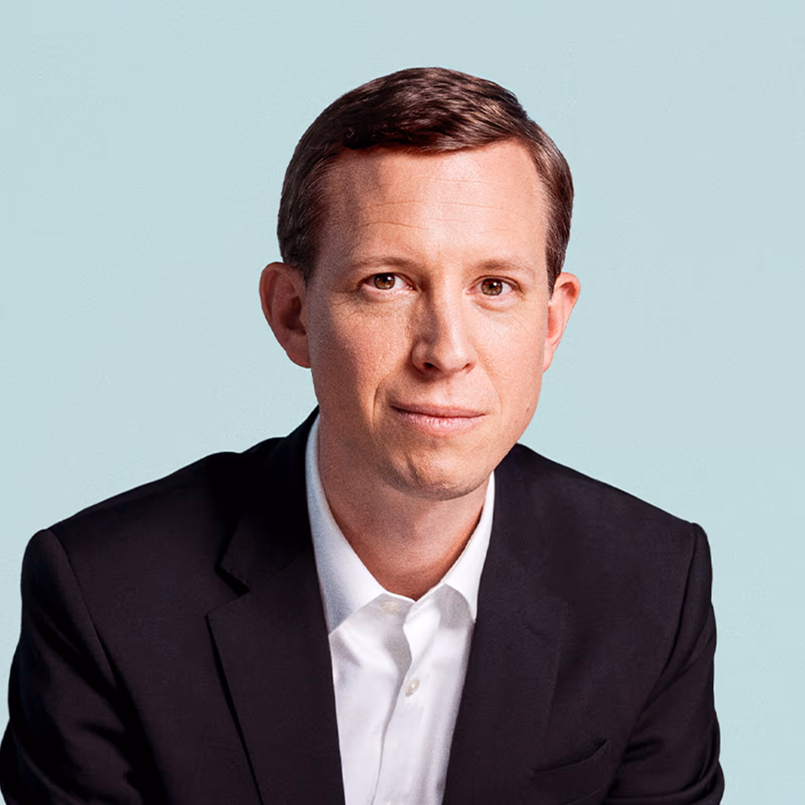 Portrait of Thomas Ogilvie against a light background.