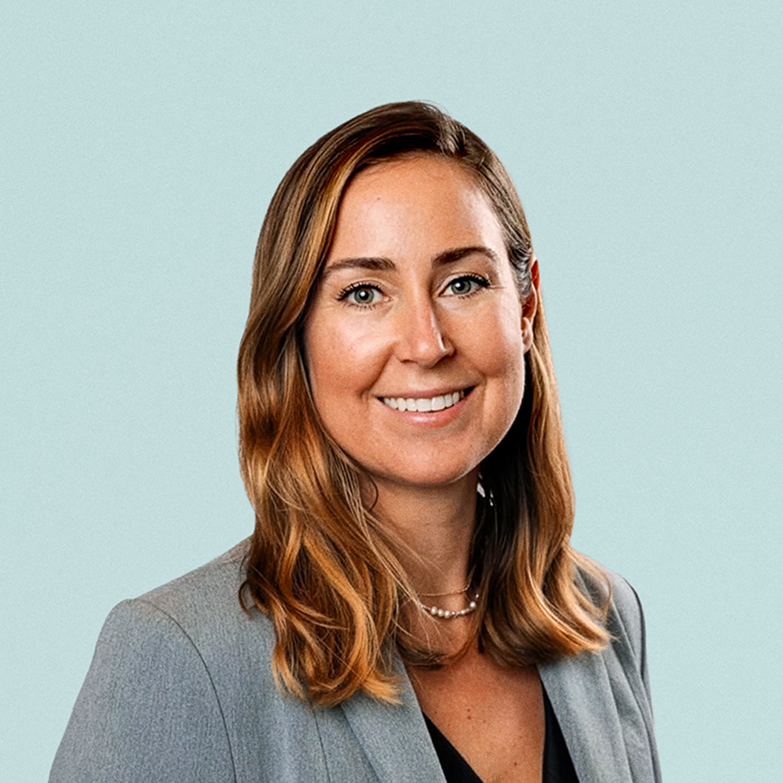 Portrait of Karina Monesson against a light background.
