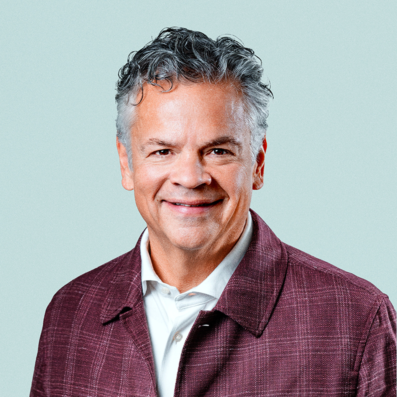 Portrait of Alberto (Beto) Casellas against a light background.