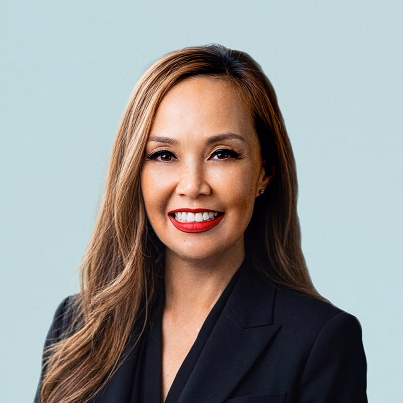 Portrait of Melissa Madriaga against a light background.