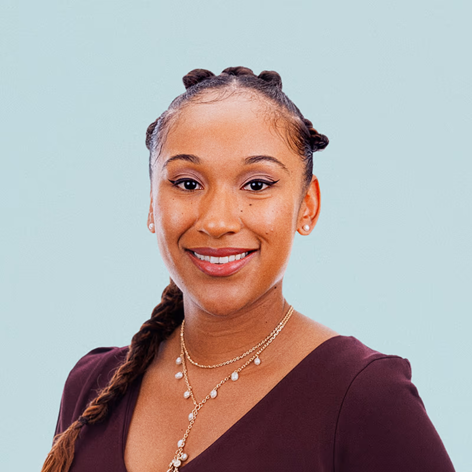Portrait of Sarah Arguello against a light background.