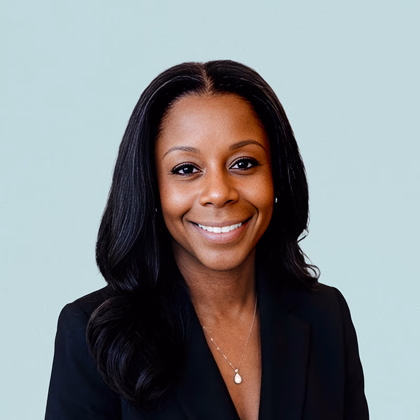 Portrait of Nicole Bell against a light background.