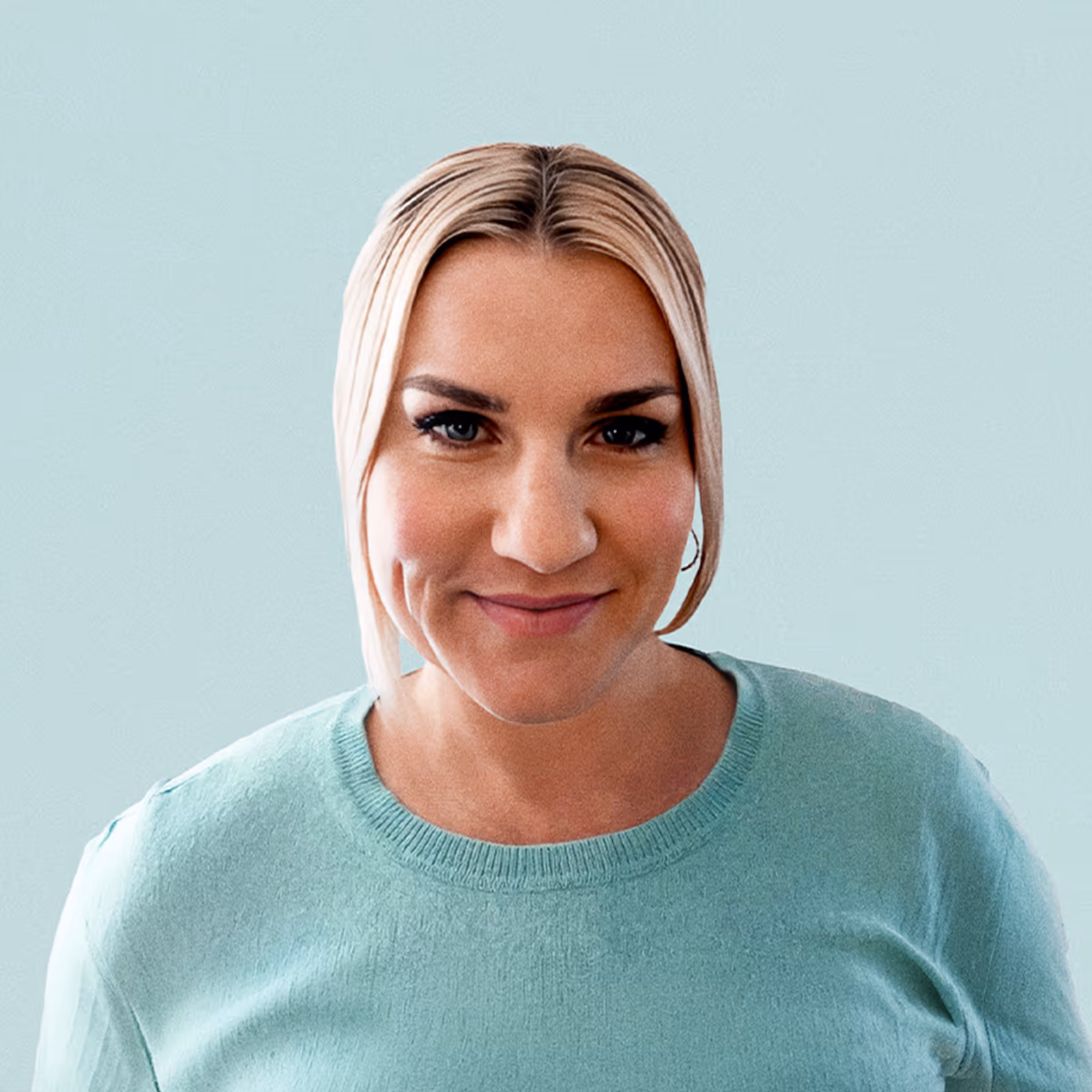 Portrait of Gina Vidal against a light background.