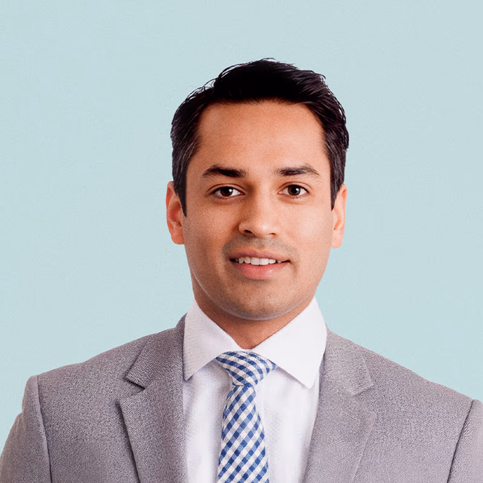 Portrait of Harsh Mathur against a light background.