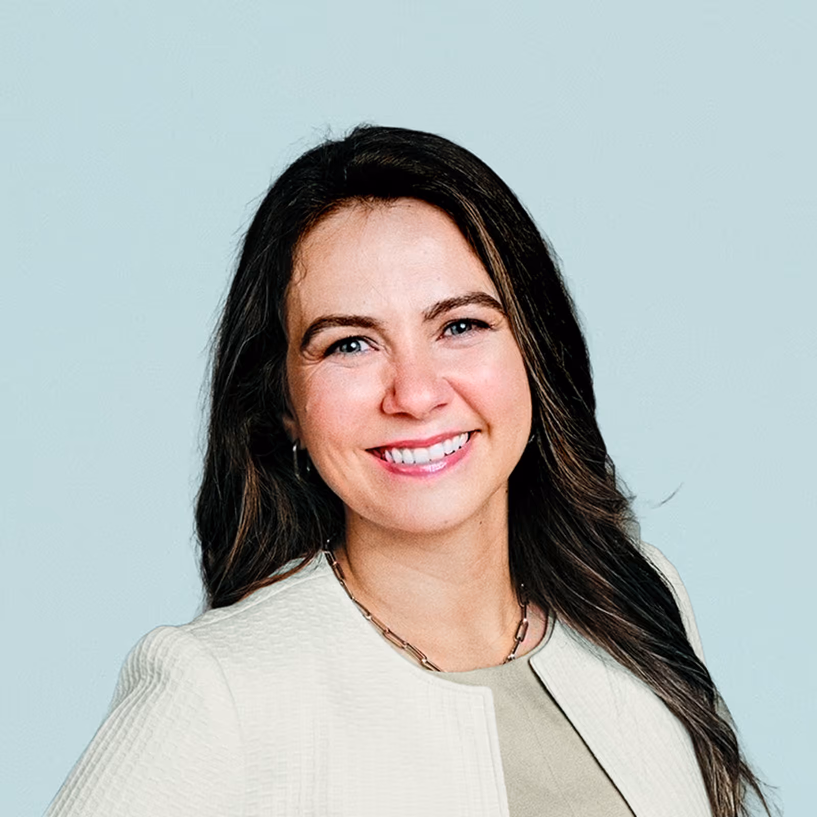 Portrait of Mayra Cardenas against a light background.