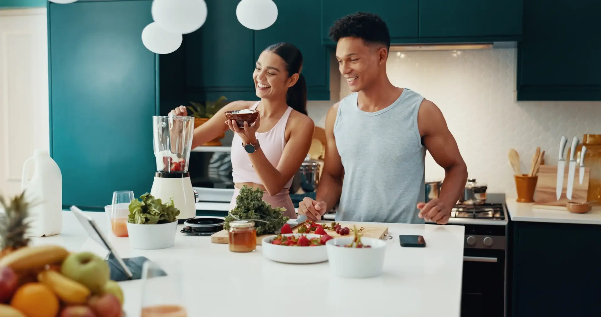 A couple making food in the kitchen.