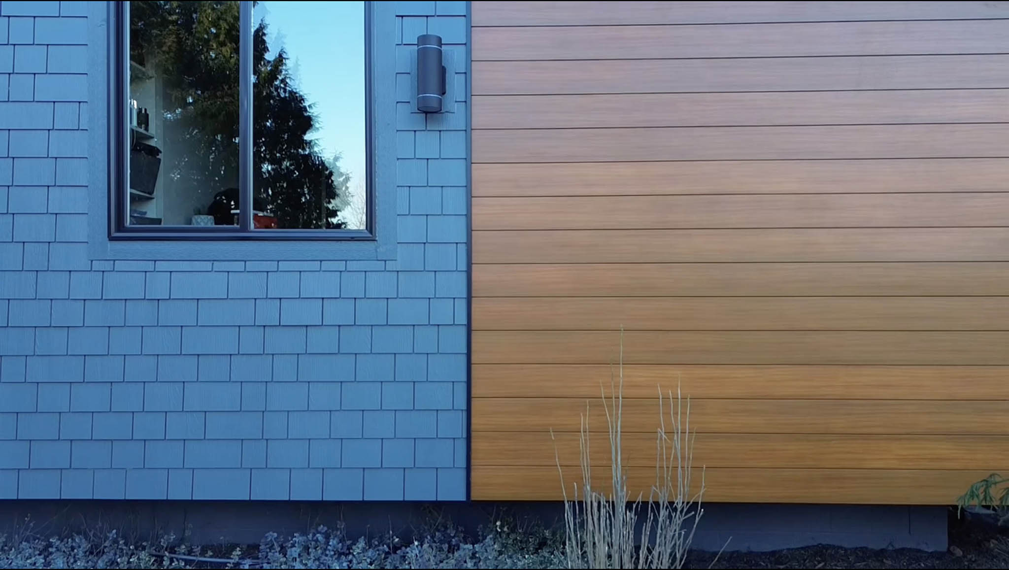 blue shingles and brown metal siding