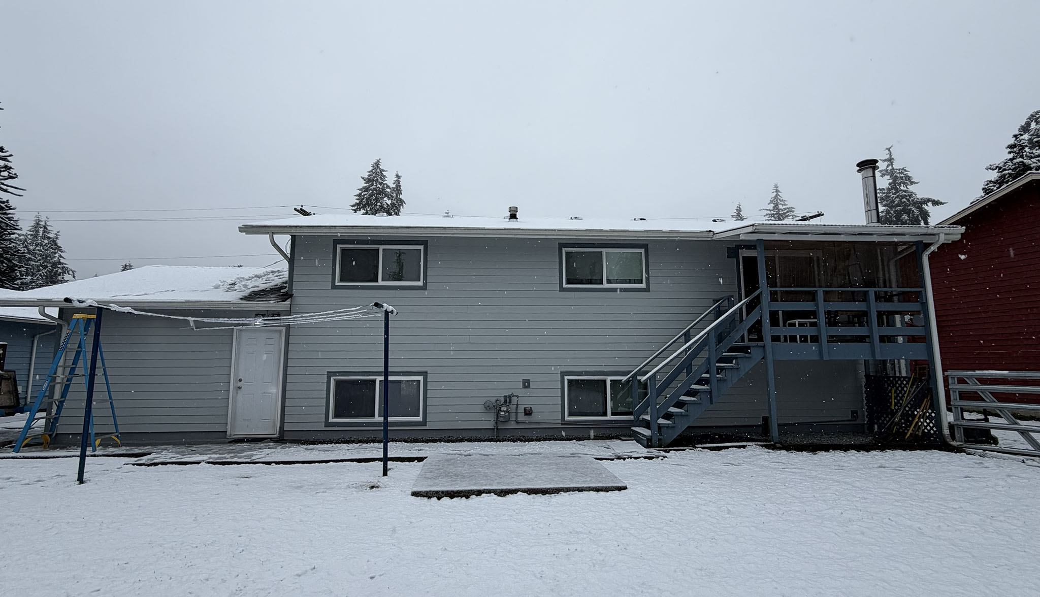 back of house with gray lap siding