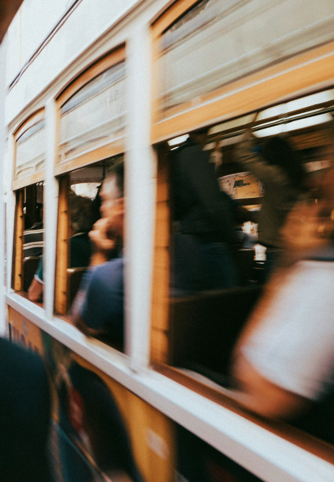 Motion-blurred streetcar passing by, evoking the pace, energy, and lived experience that inform destination and place-brand storytelling.