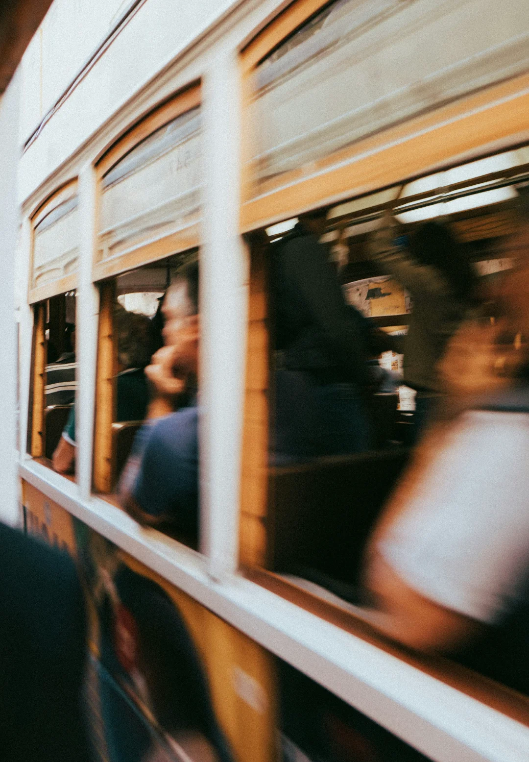 Motion-blurred streetcar moving through the city, evoking the pace, energy, and atmosphere that influence destination branding.