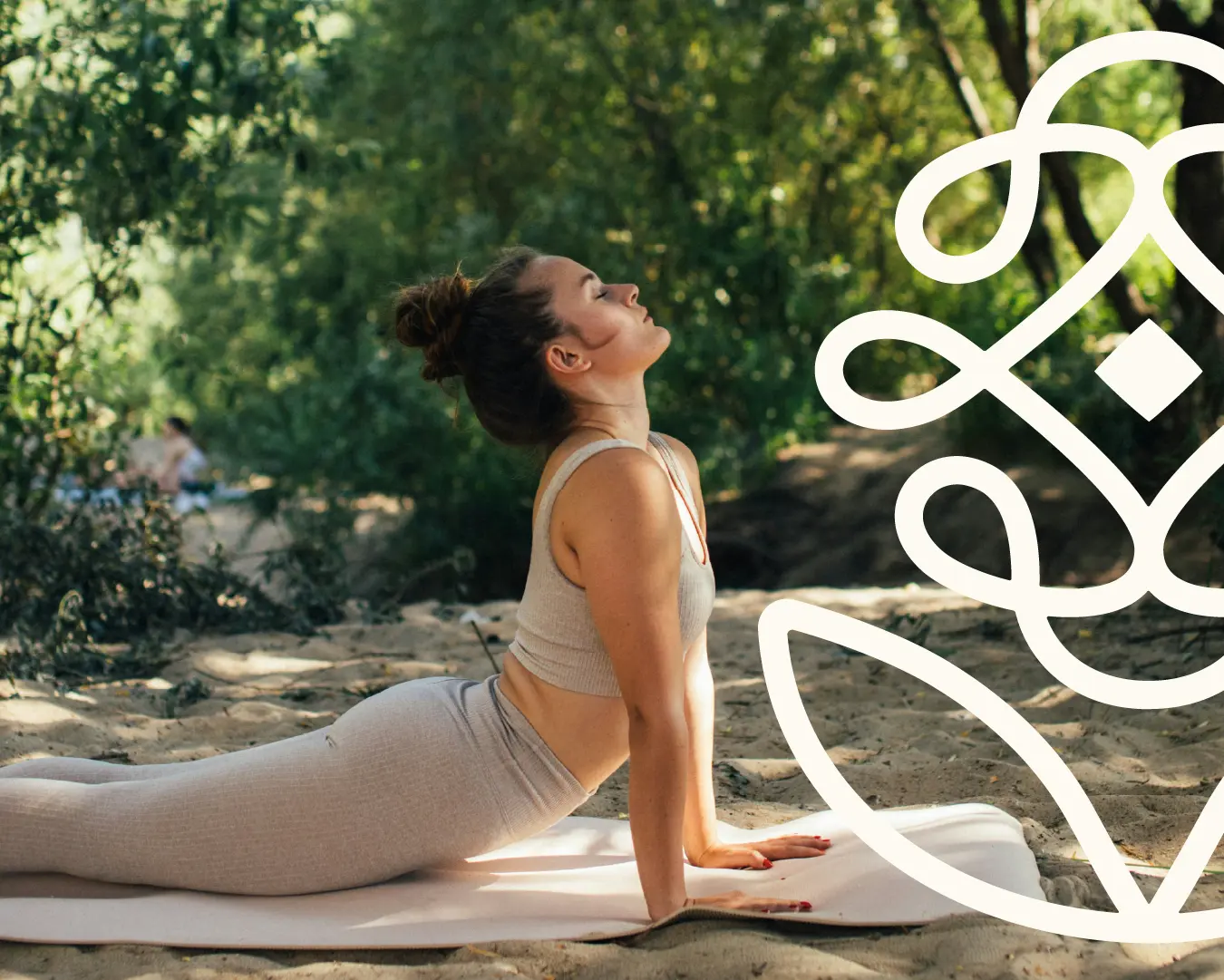 Person practicing an upward dog yoga pose outdoors on a mat, with an oversized Reyou logo overlay on the right.