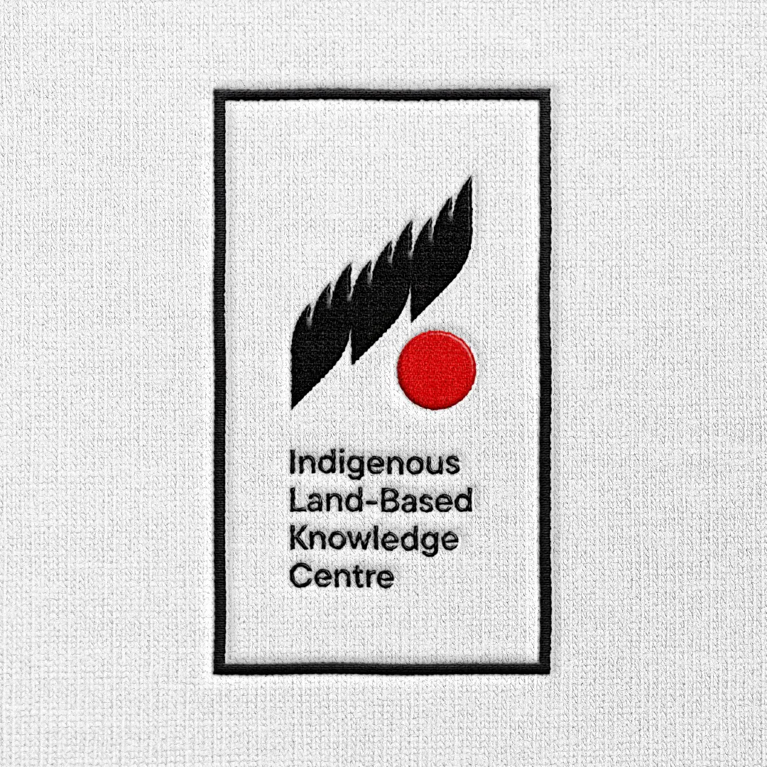 Embroidered patch featuring the logo mark and “Indigenous Land-Based Knowledge Centre” text on textured fabric.