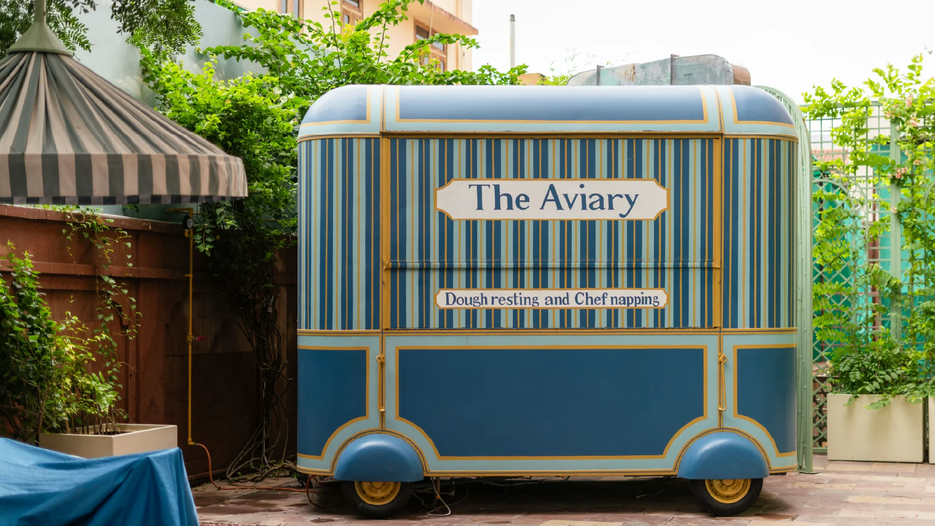 A colourful branded cart for The Aviary, showing how visual identity can shape a guest experience.