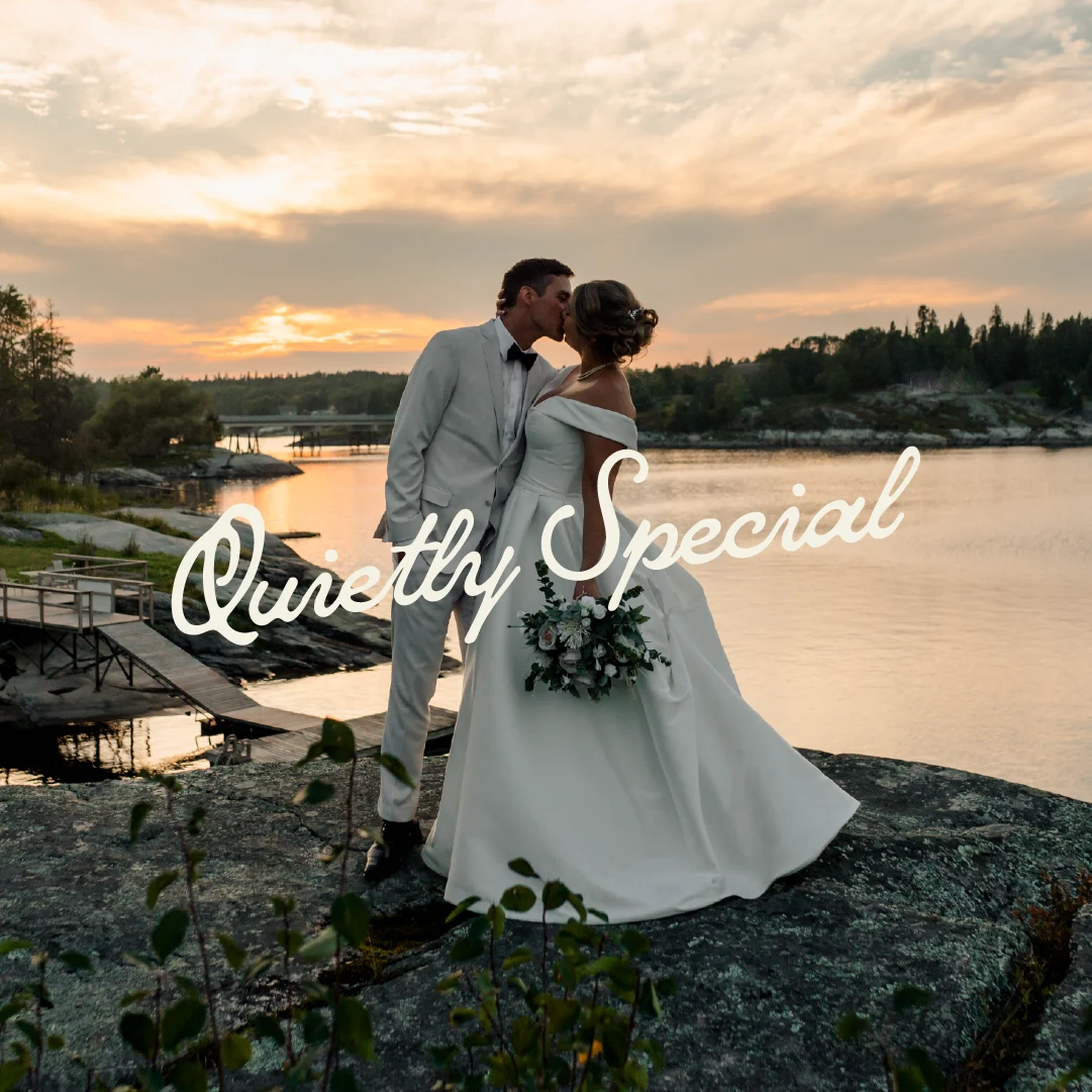Newly married couple kissing on the rocky waterfront at sunset at The Lodge at Perch Bay, with the words “Quietly Special” overlaid.