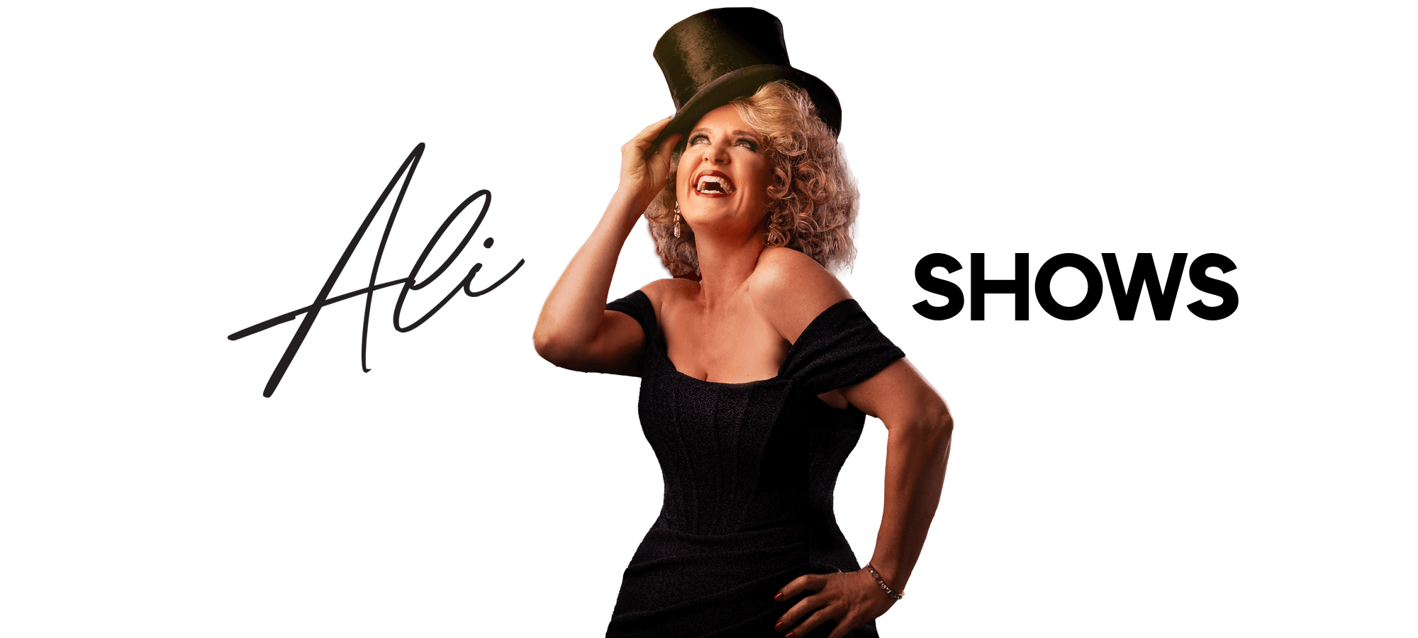 Ali Harper is wearing a top hat acting cabaret style. This image shows the heart of my creative stage life, with many years of acting and singing, even on cruise ships.