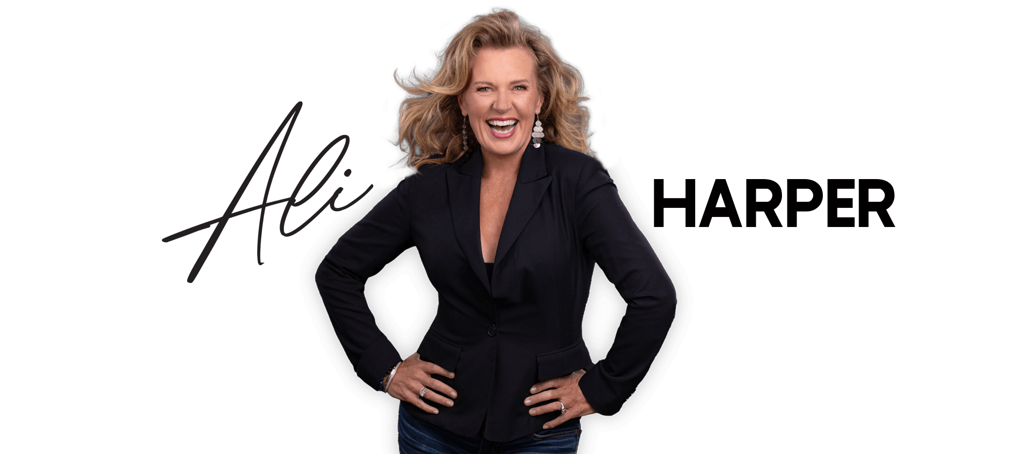 Ali Harper smiling and standing with arms on her hips in a black jacket, welcome to my website, where you can find about my acting, motivational speaking, yoga retreats and overseas tours.