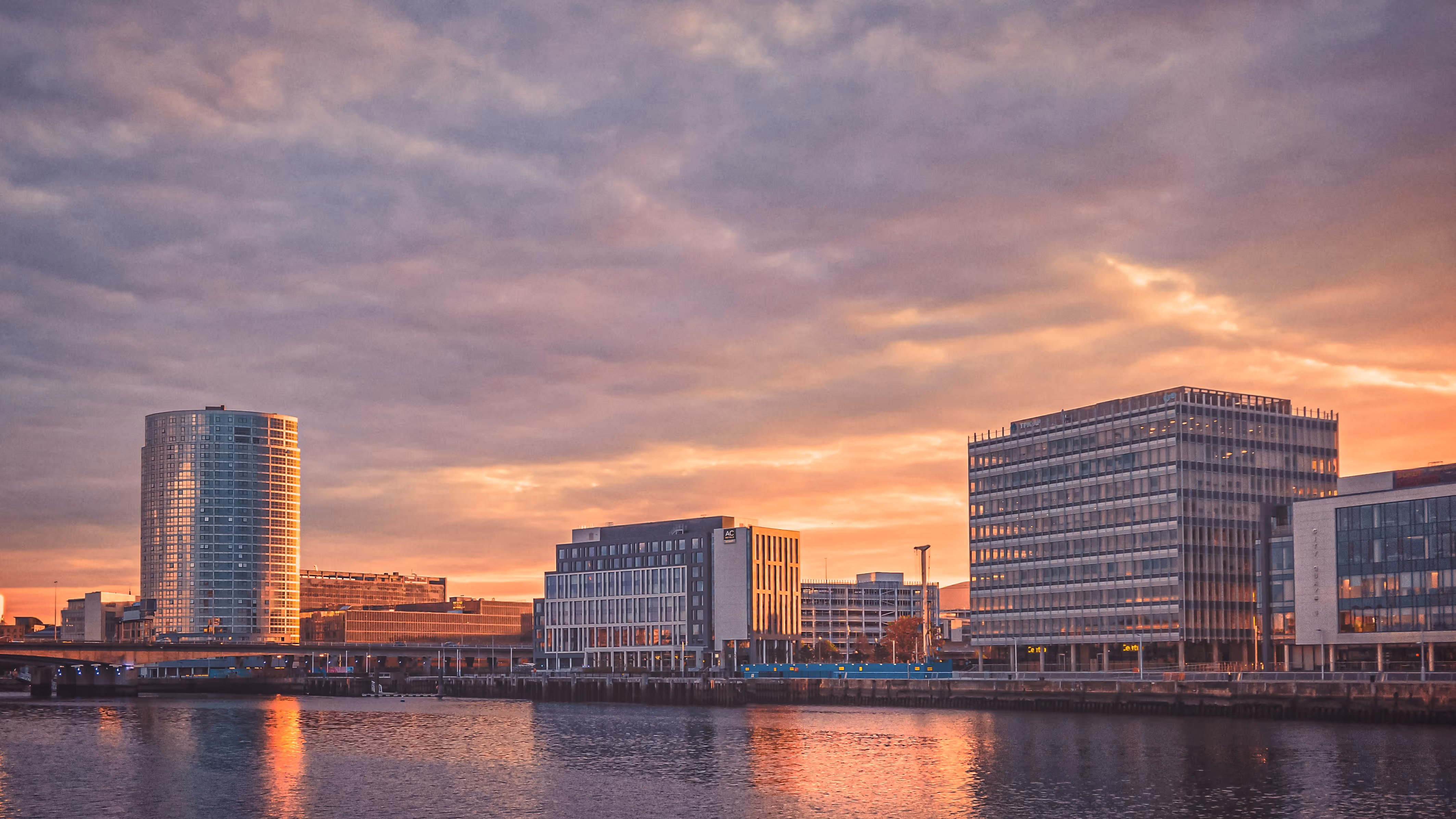 Large buildings beside a river in Belfast, Northern Ireland