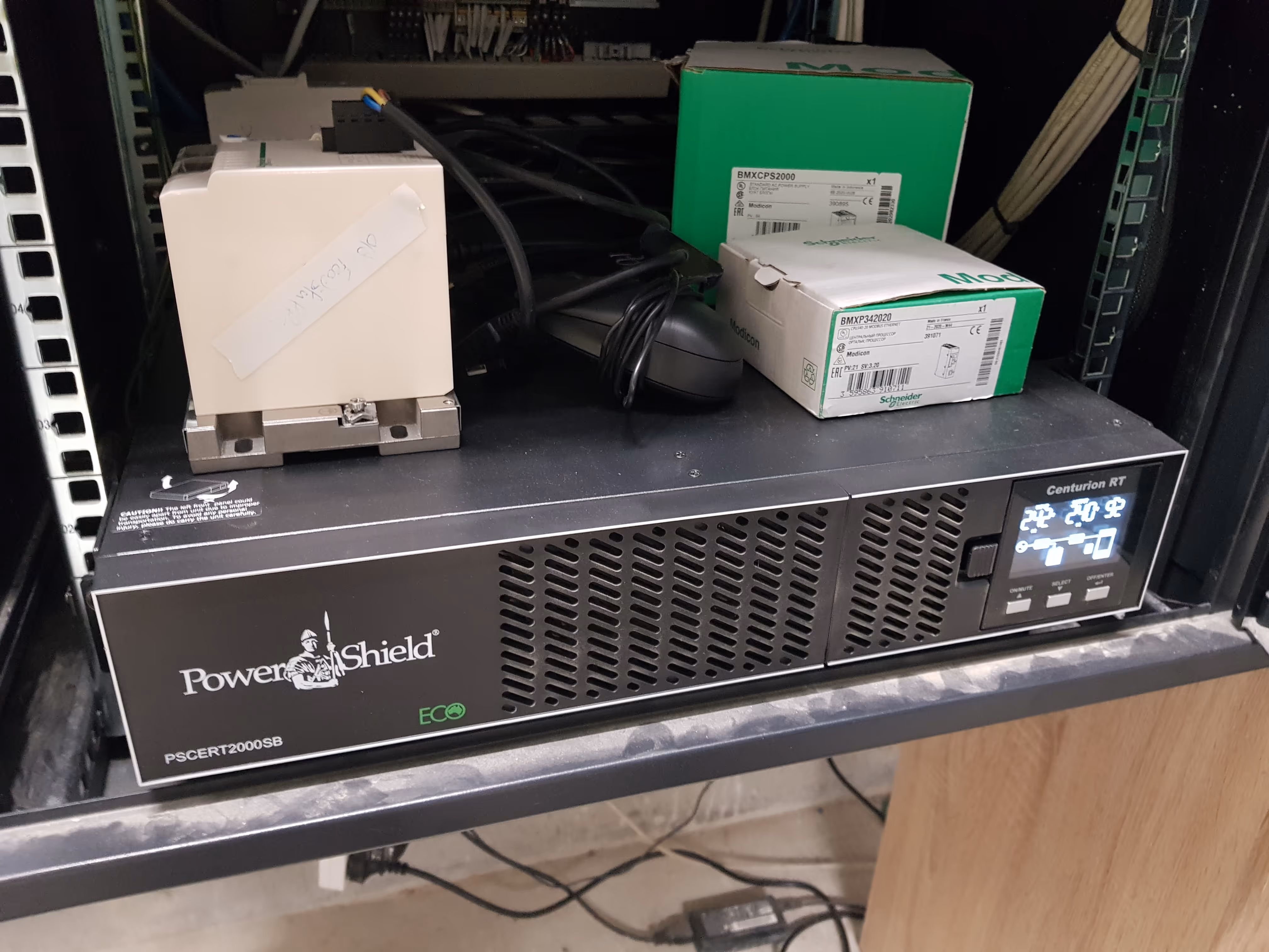 A picture of a UPS with some boxes on top of it