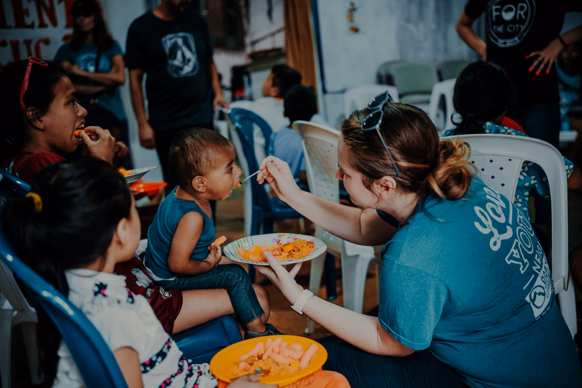Mission Team member feeding a baby in Costa Rica