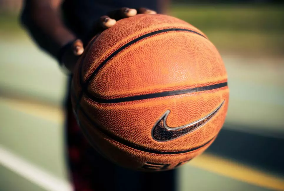 Hand on a basketball