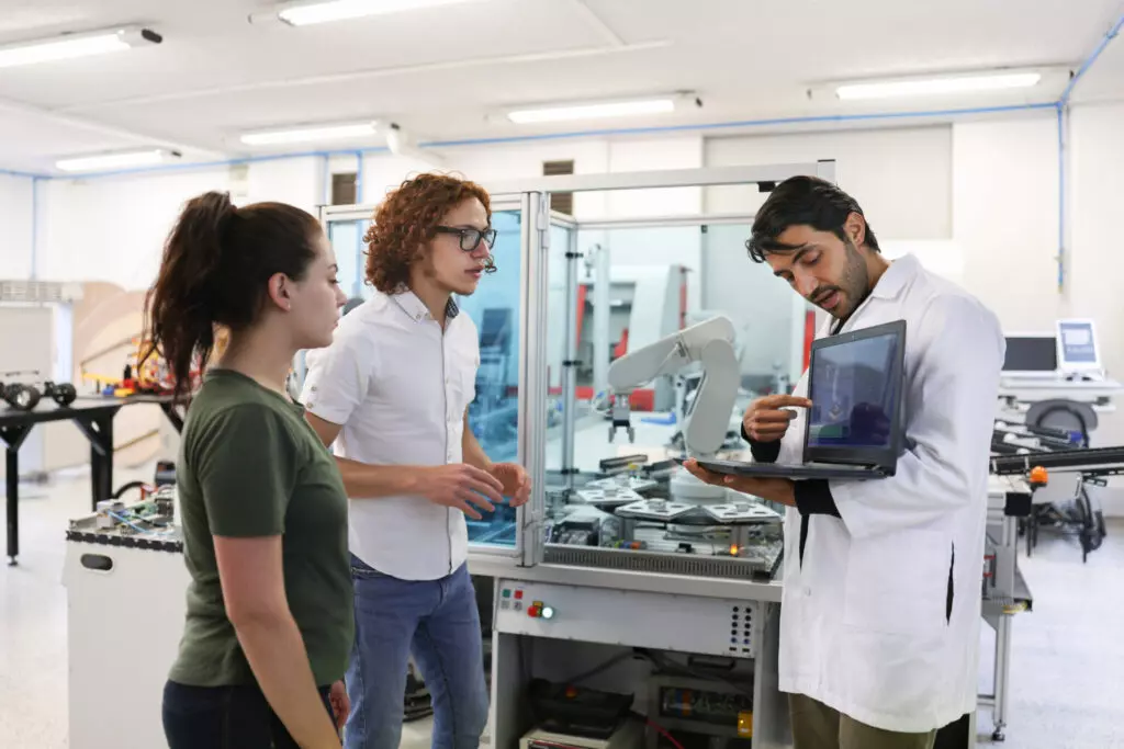 Students exploring AI in a robotics lab