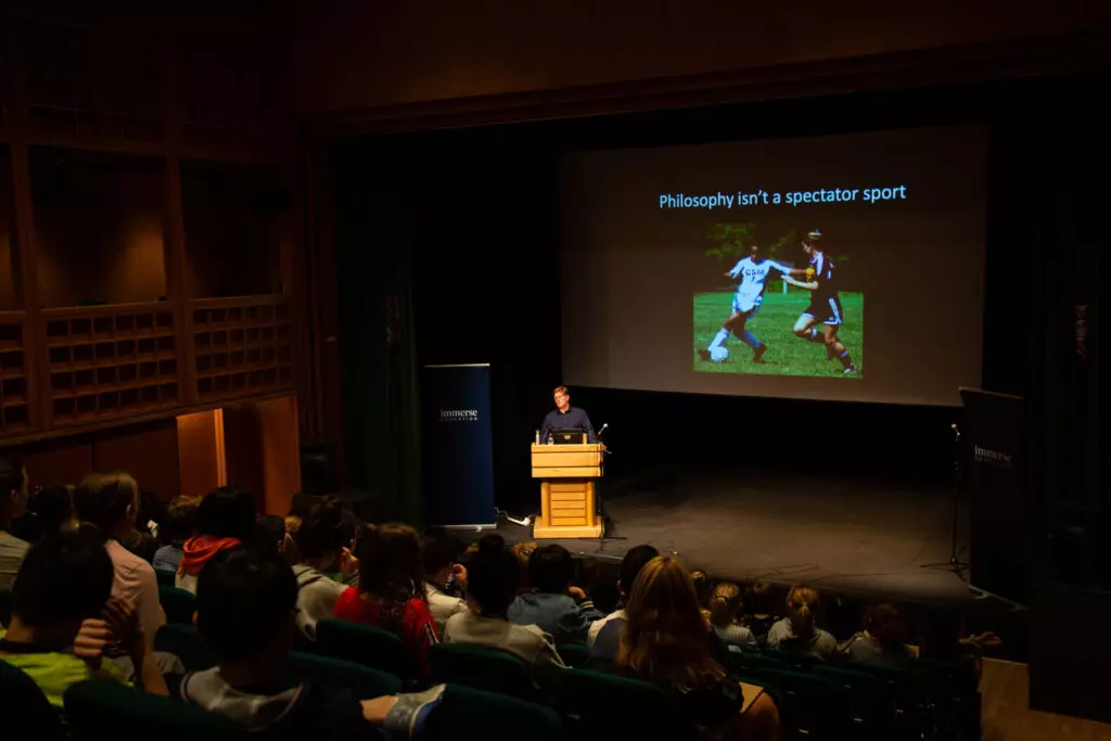Tutor delivering a philosophy lecture