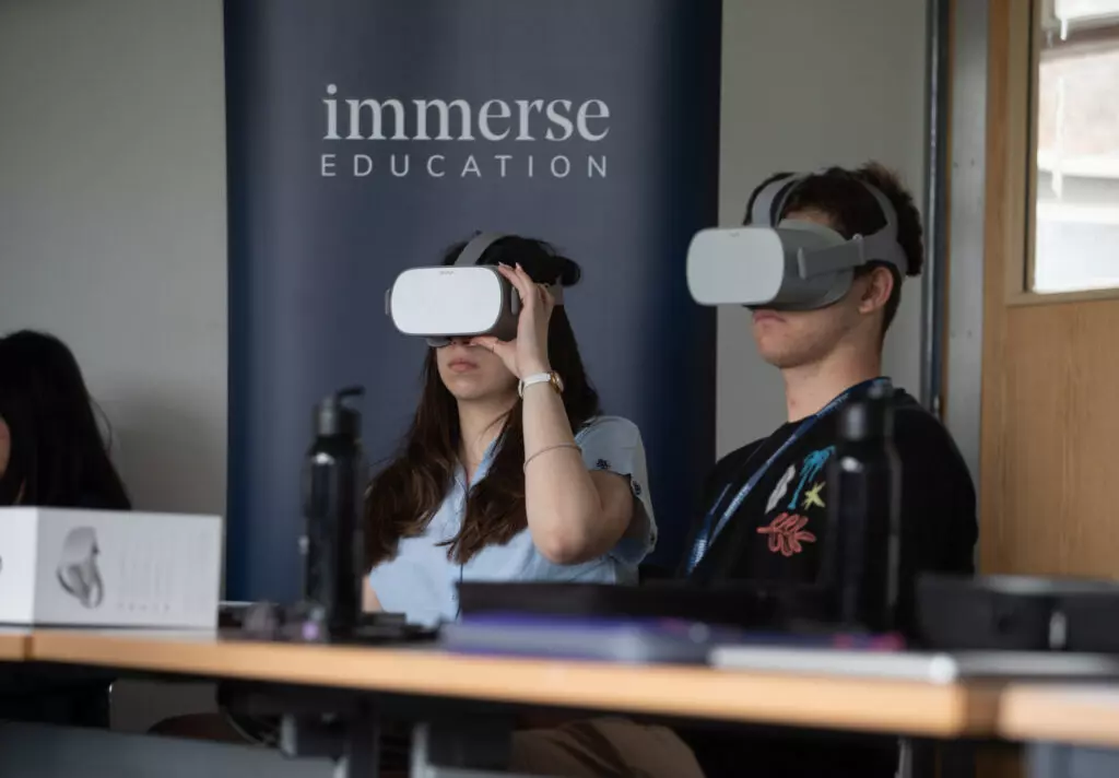 Students using VR in a lesson on coding