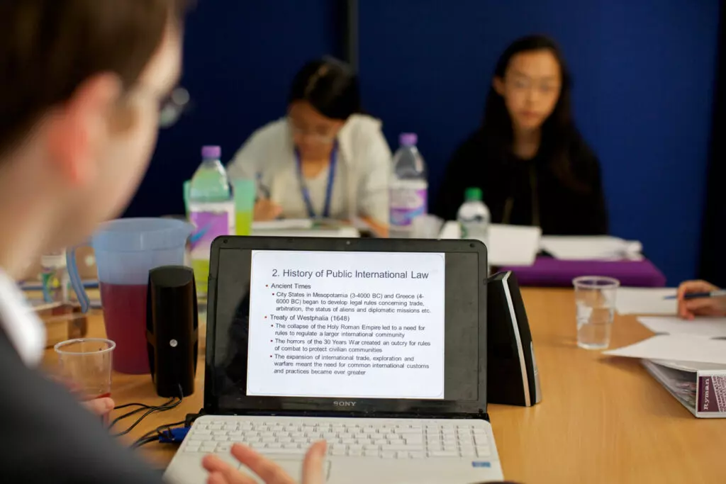 Students looking at a slideshow about law
