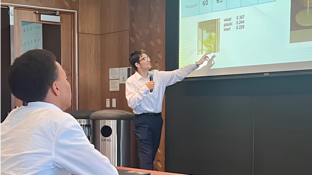 An instructor teaching from a presentation displayed on a projector.