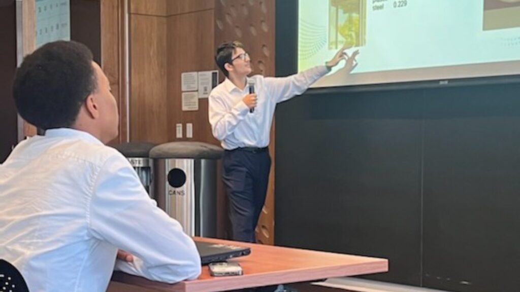 An instructor teaching from a presentation displayed on a projector.