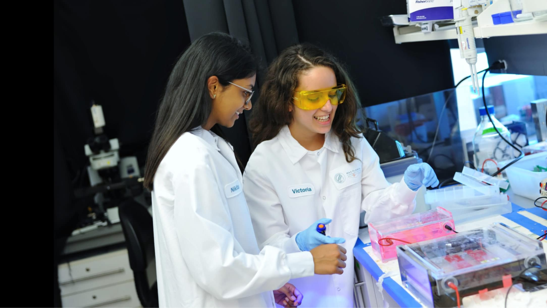Two students working together on something in the laboratory