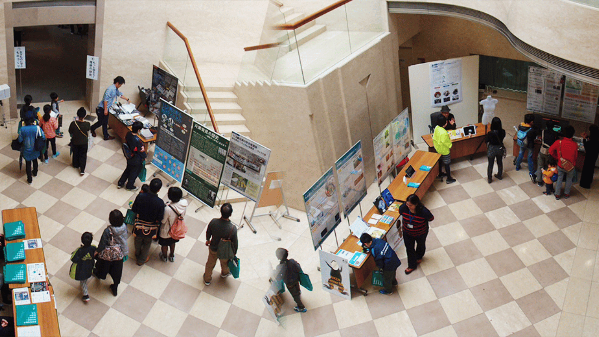 An aerial view of a poster presentation in a room