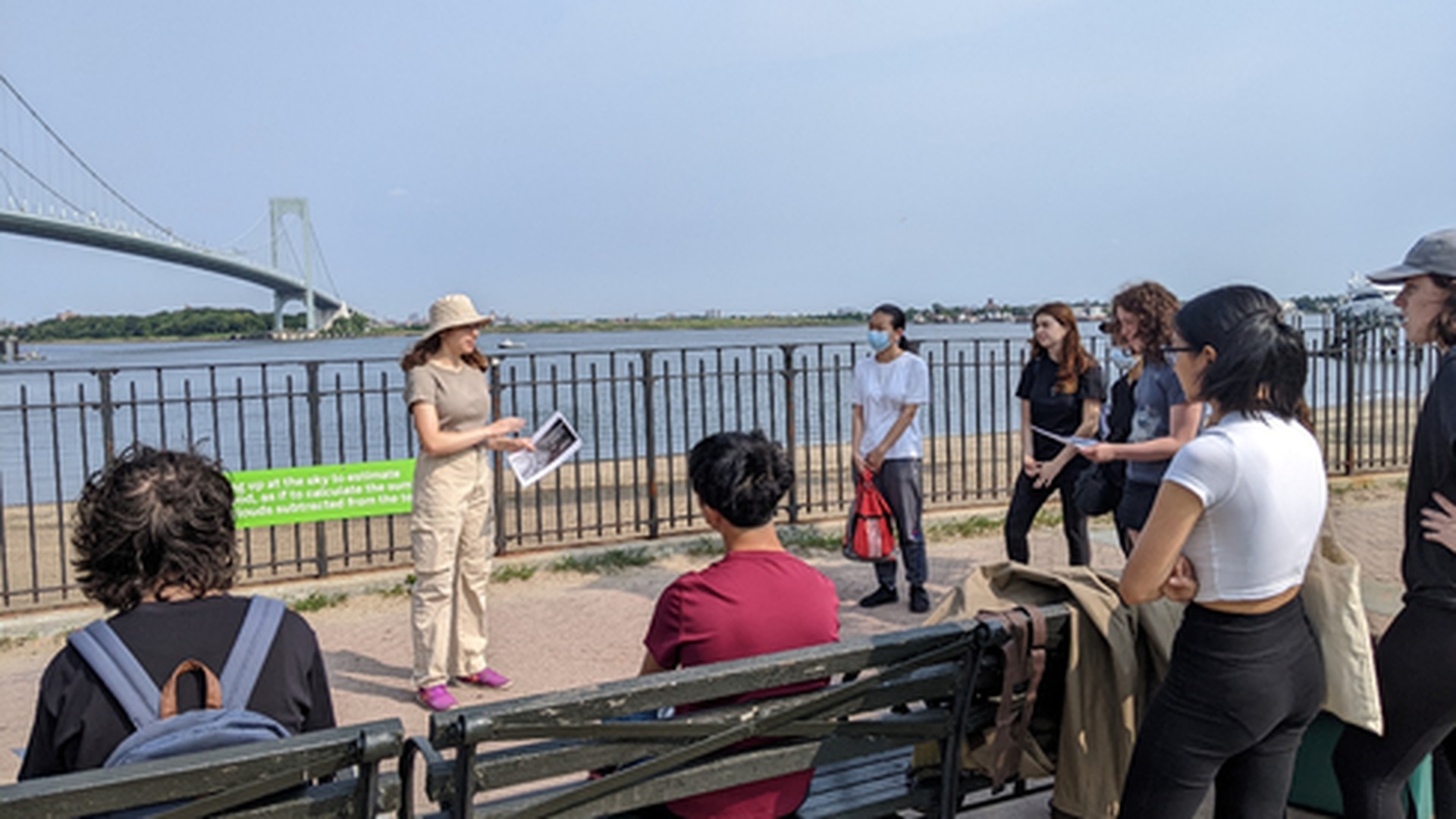 An instructor standing in front of a group of students during a field trip
