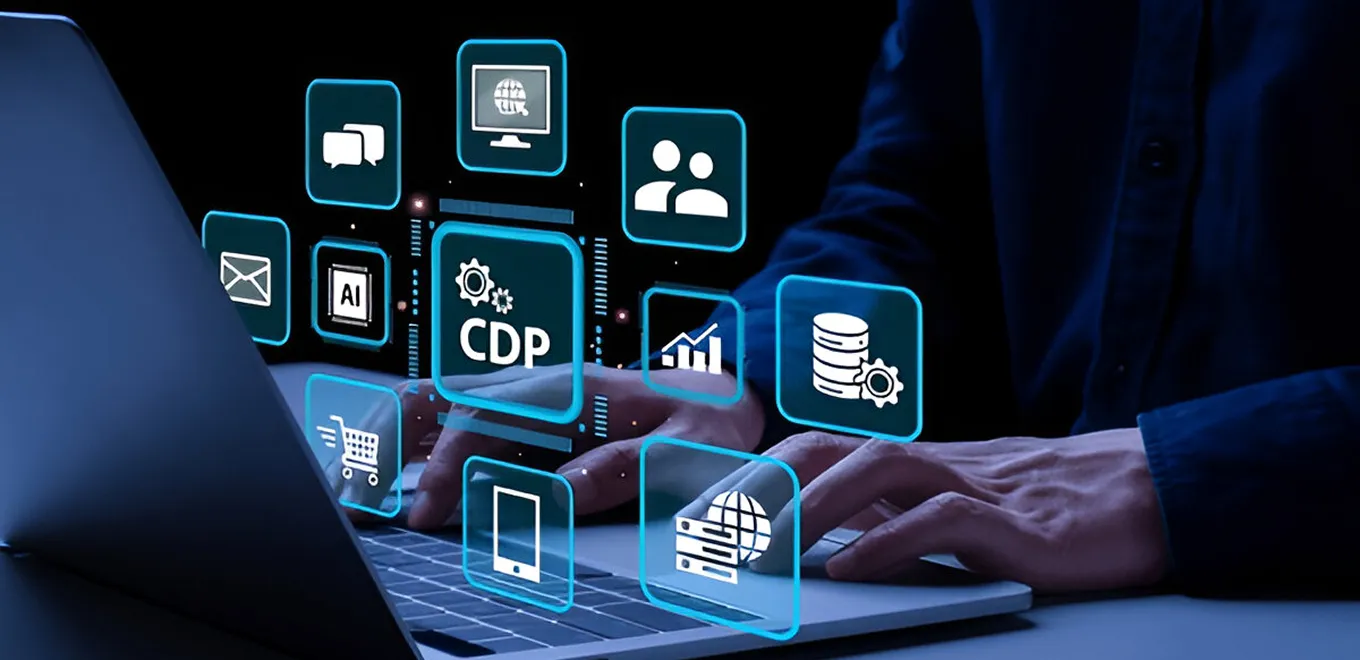 Person using laptop with digital CDP icons