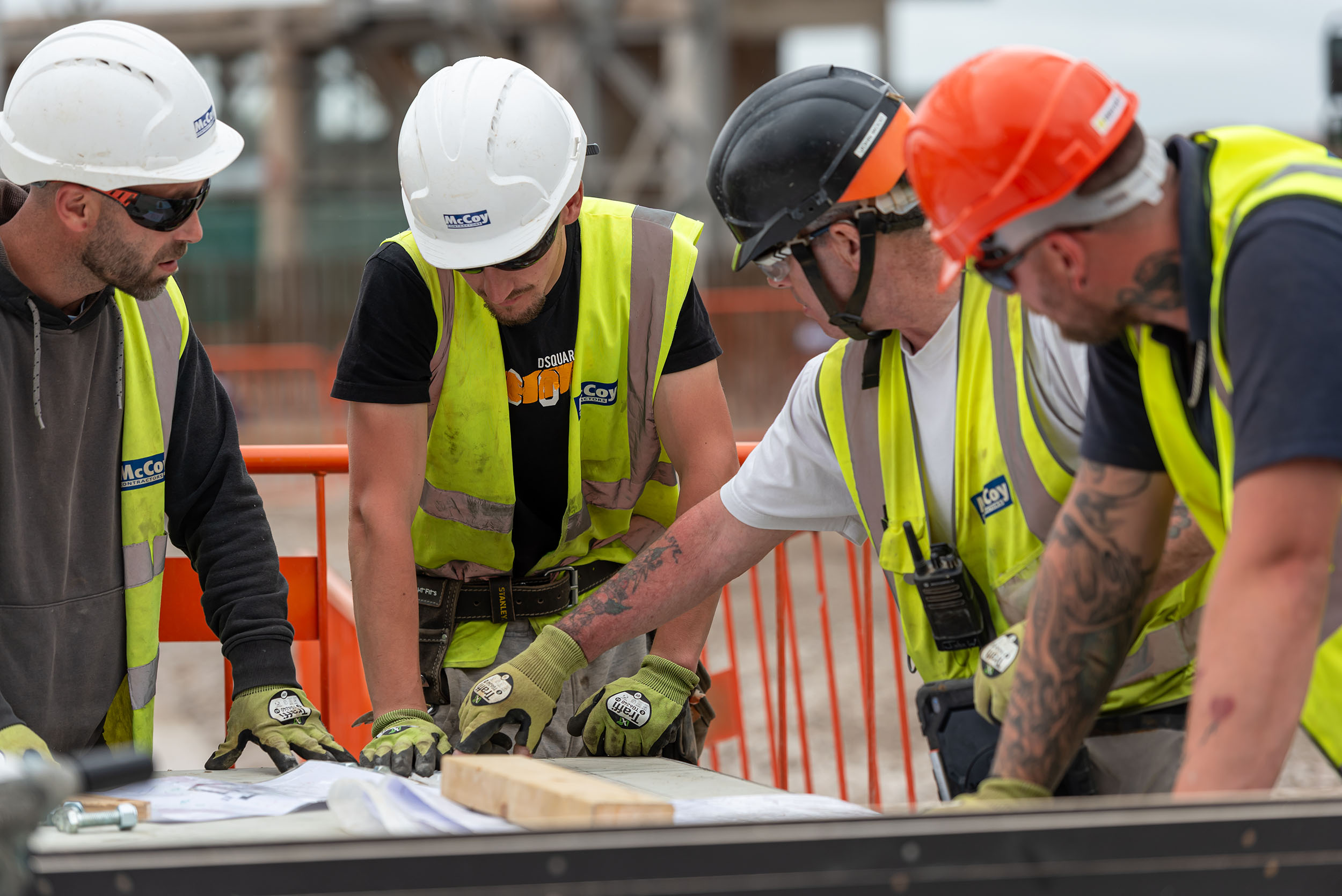 McCoy Contractors workers looking at construction drawings and plans