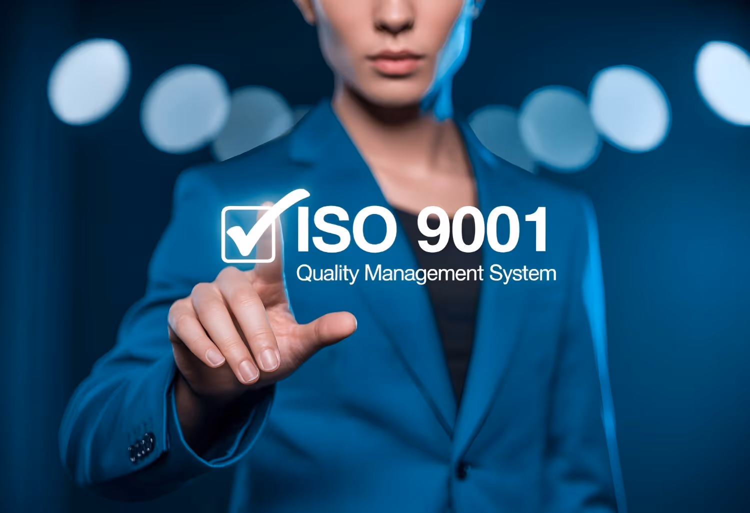 A woman, selecting a checkbox labelled ISO9001