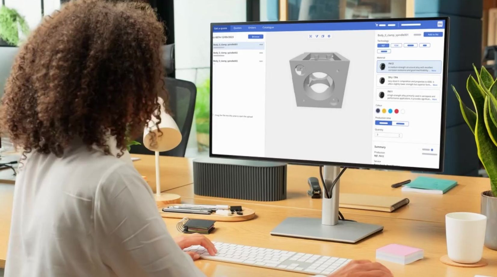 A woman working on a 3D model of a part in AMFG.