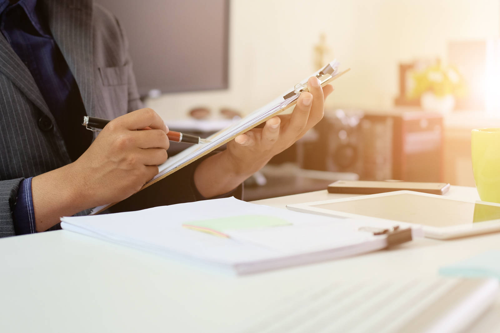 A person compiling documents of trade