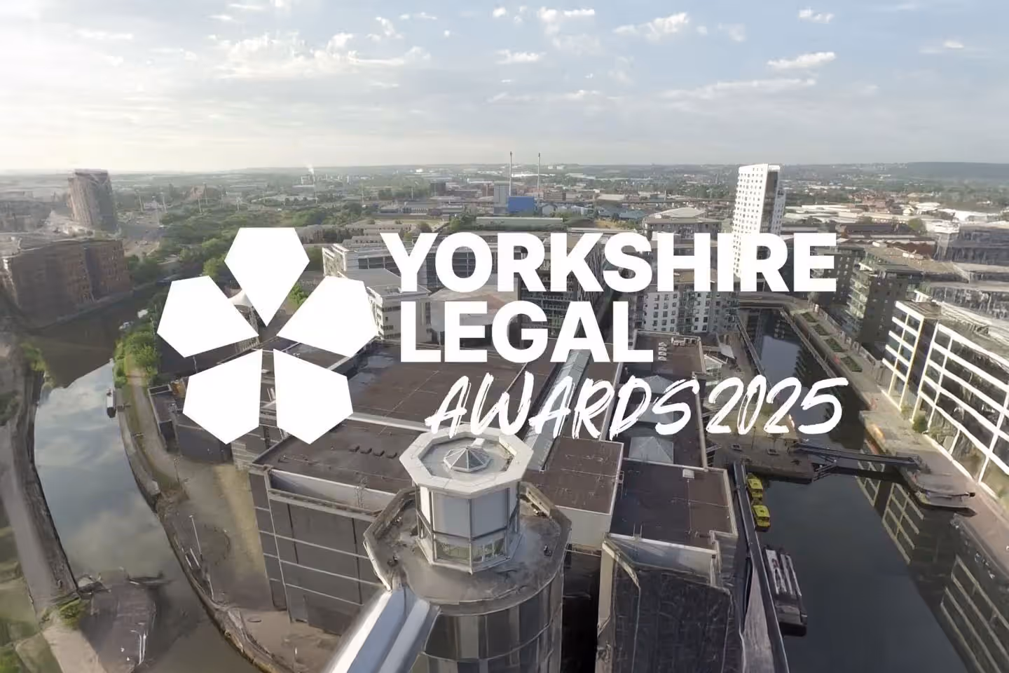 Aerial view of urban buildings with the text "Yorkshire Legal Awards 2025" prominently displayed.