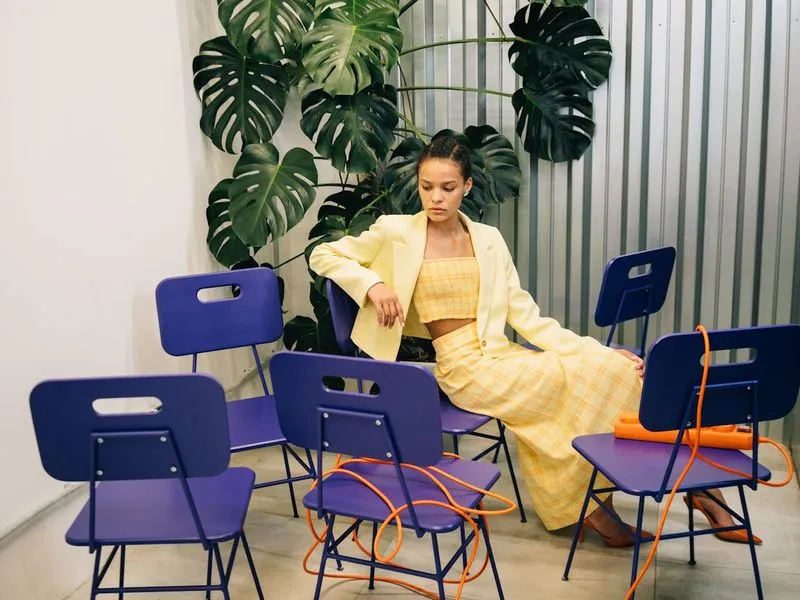 Image of a woman sitting in a chair.