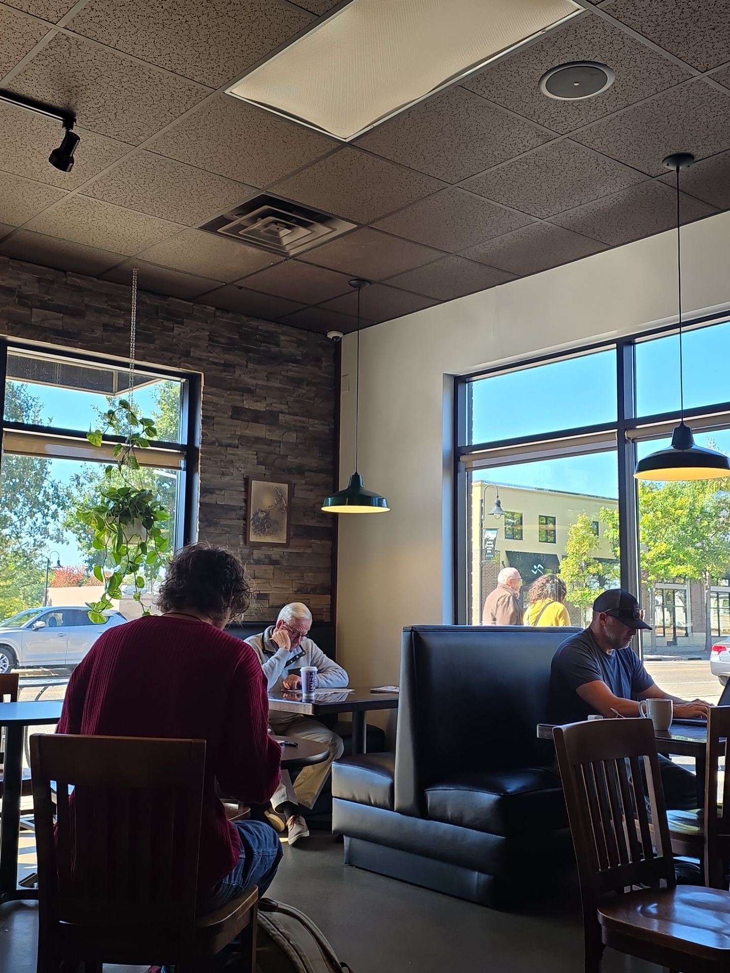 Customers seated inside a local coffee shop.