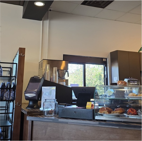 Customers seated inside a local coffee shop.