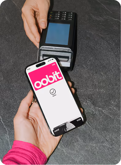 Oobit crypto card in pink, a Visa card for paying with crypto