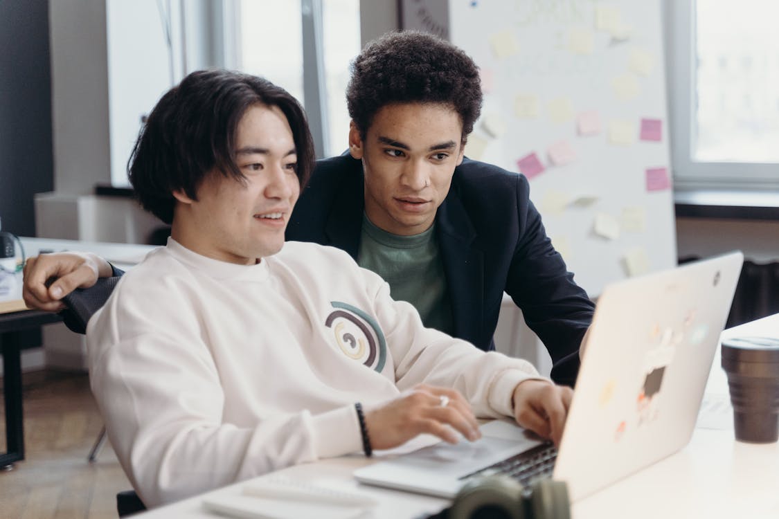 Free Men Working Together in the Office Stock Photo