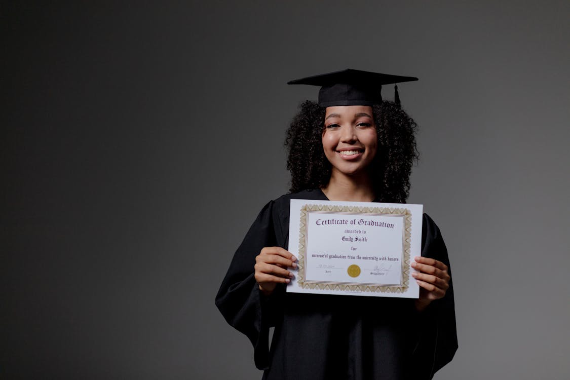 A girl holding a degree