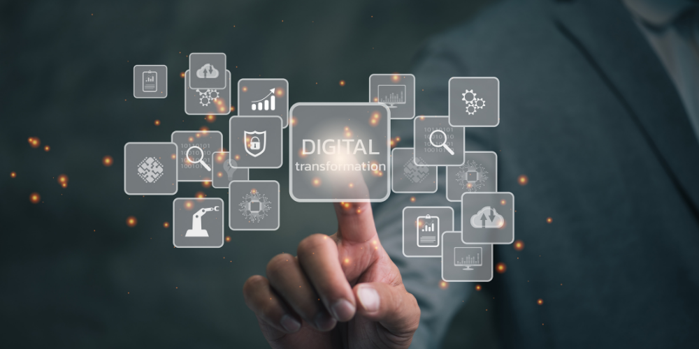 A person is interacting with a transparent digital interface with icons and the words "DIGITAL transformation" highlighted, signifying concepts related to technology, innovation, and modernization in business or industry.