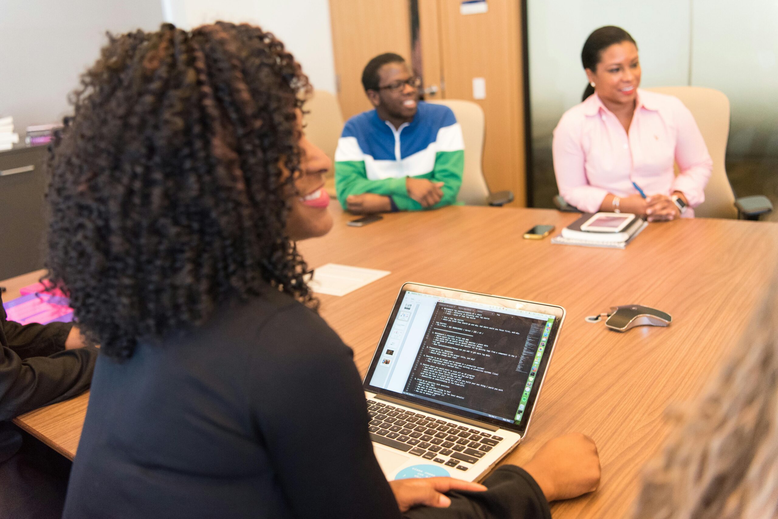 Business team in a meeting discussing strategies with an affordable accountant.