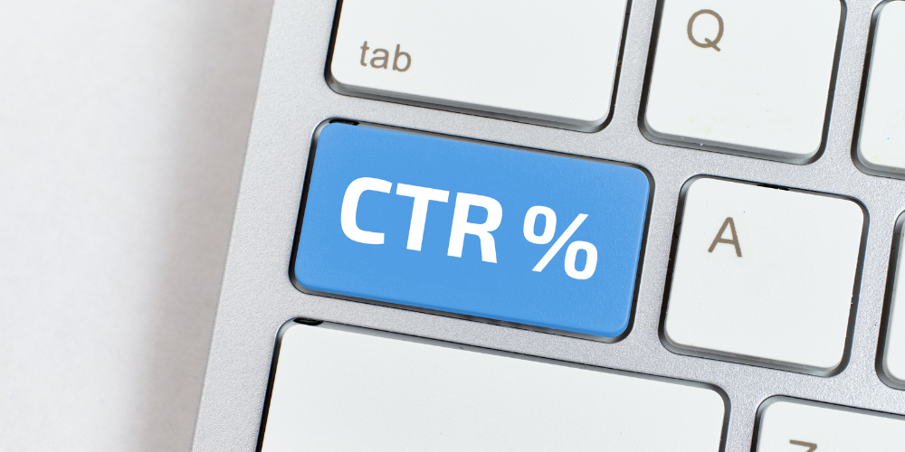 A close-up of a computer keyboard with a blue key labeled "CTR%" for click-through rate percentage.